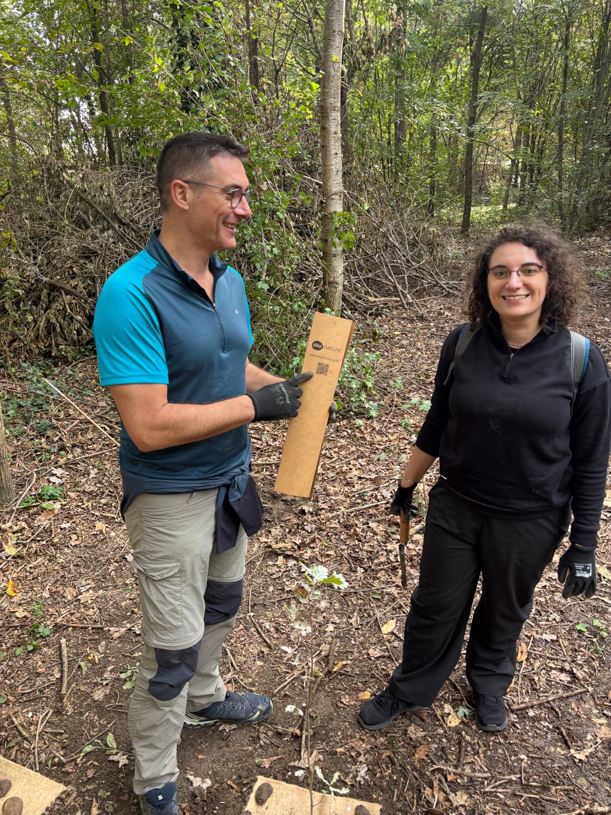 Teachersrise representatives showing a tree marker